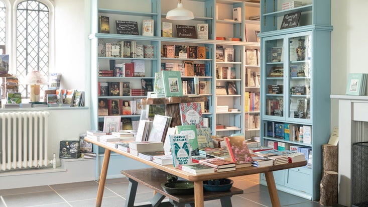 Books displayed on a wooden table in the Bookshop at Knole Kent